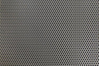 yuvarlak delikli delikli metal levhaların arkaplanı