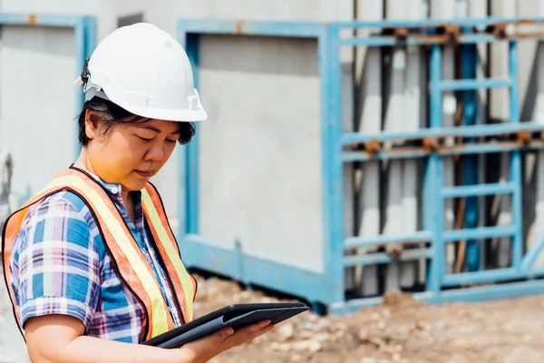 Woman construction engineer at construction site