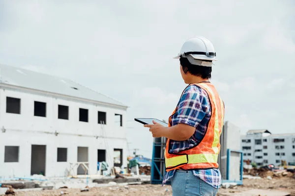 Woman construction engineer at construction site