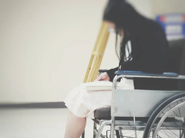 Patient waiting a doctor on wheelchair in hospital