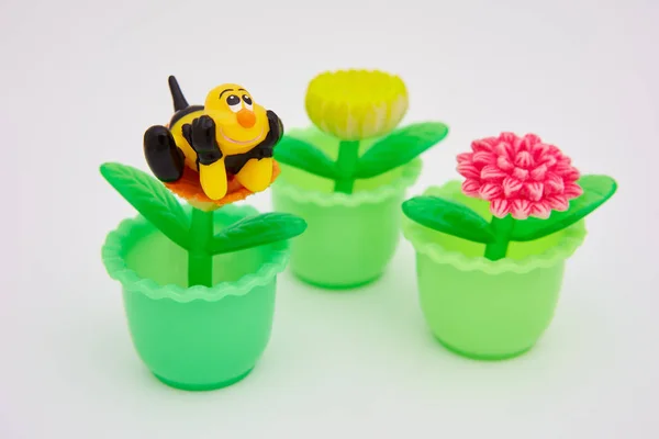 Small Plastic Toy Flowers Pots Toy Lucky Bee Royalty Free Stock Photos