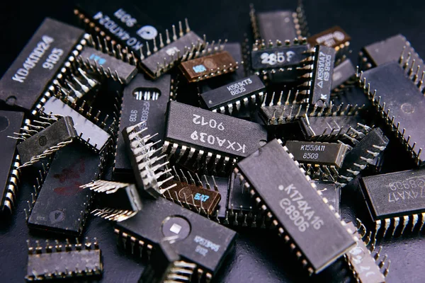 Electronic chip on black background, pile