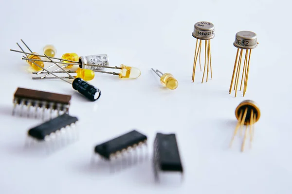 electronic chip and radio parts on a white background, good composition