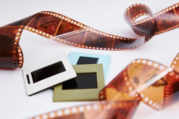 film and slides on a white background, in a beautiful composition