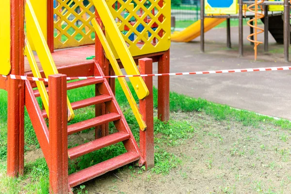 Yellow Slide Children Entertainment Park Wrapped Red Barrier Tape Prohibition — Stock Photo, Image