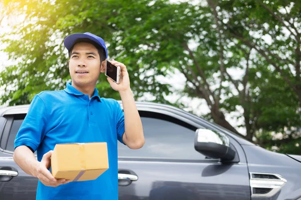 messenger man hold box and talk on smart phone and payment terminal in hands, Package delivery concept