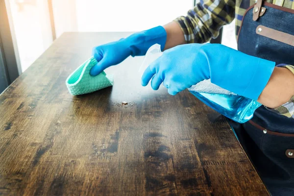 Man Cloth Cleaning Wooden Table Home Uses Rag Fluid Spray — Stock Photo, Image