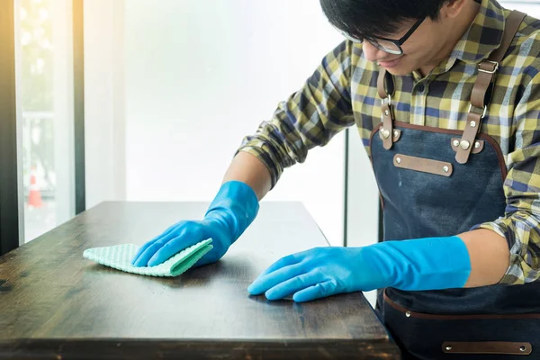 Man Cloth Cleaning Wooden Table Home Uses Rag Fluid Spray — Stock Photo, Image