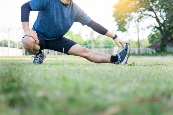 Portrait of fatigued young fit athletic man Muscular for health and strong guy exercising in sportswear outdoors.