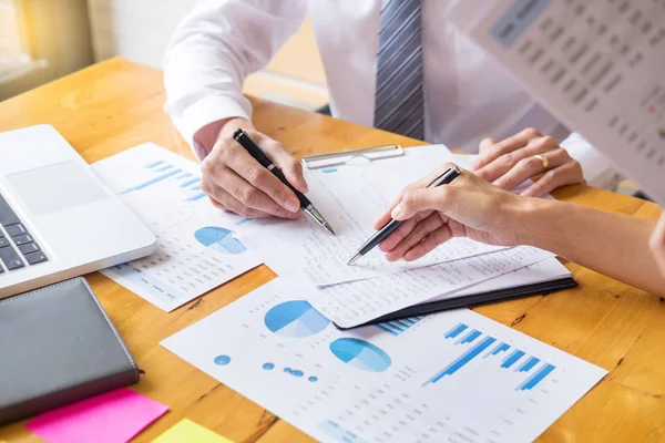 Business team data analyzing income charts document during discussion explain strategy meeting. on start-up project teamwork together