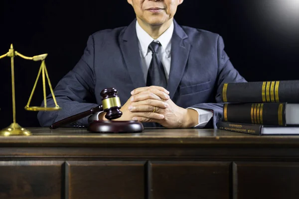 justice and law concept.Male judge in a courtroom working on wood table with documents., attorney court judge justice gavel legal legislation concept