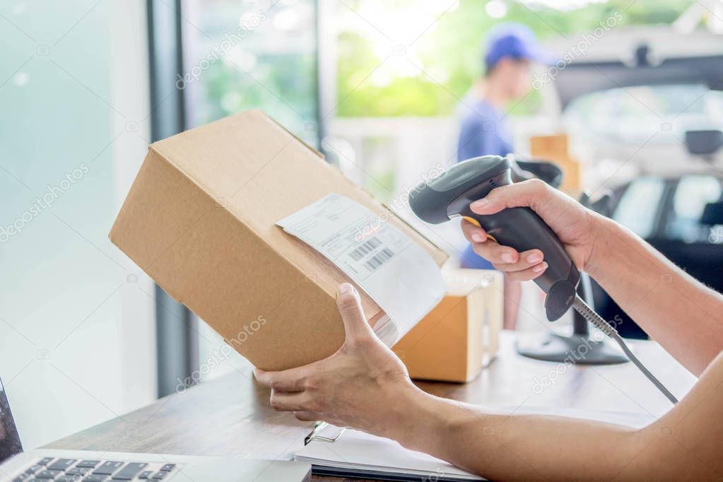 Courier hands Business woman work at home office checking parcel