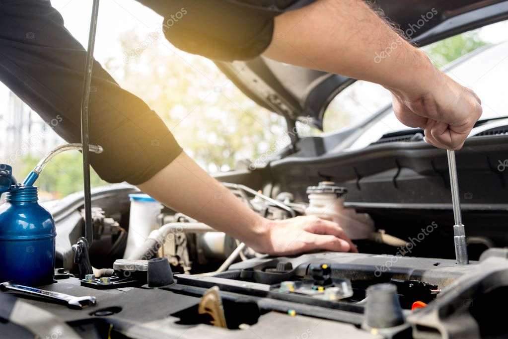 checking vehicle engine at the garage industrial concept, Hands 