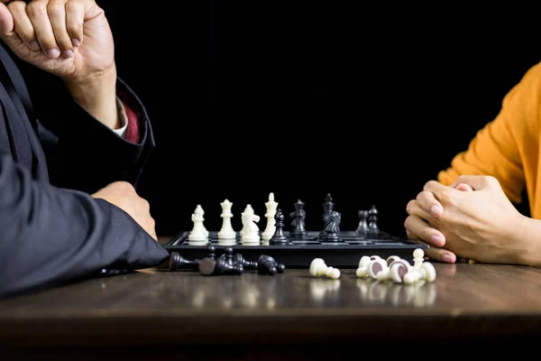 Hand of businessman moving chess figure in competition board gam — Stock Photo, Image