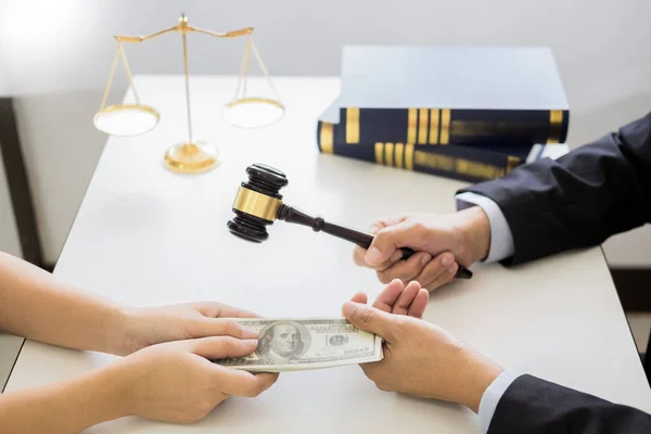Lawyer being offered receiving money as bribe from client at des — Stock Photo, Image