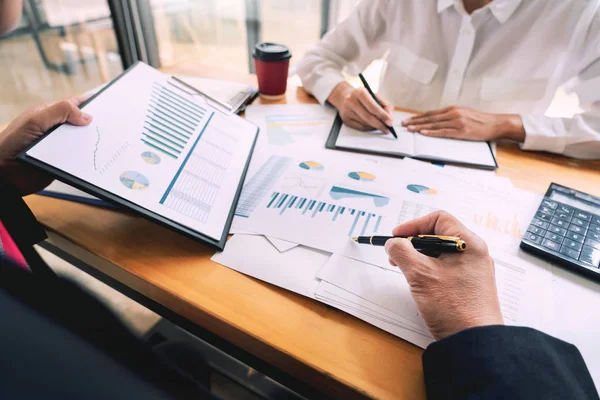 Two young businessmen partner explaining information and pointin — Stock Photo, Image