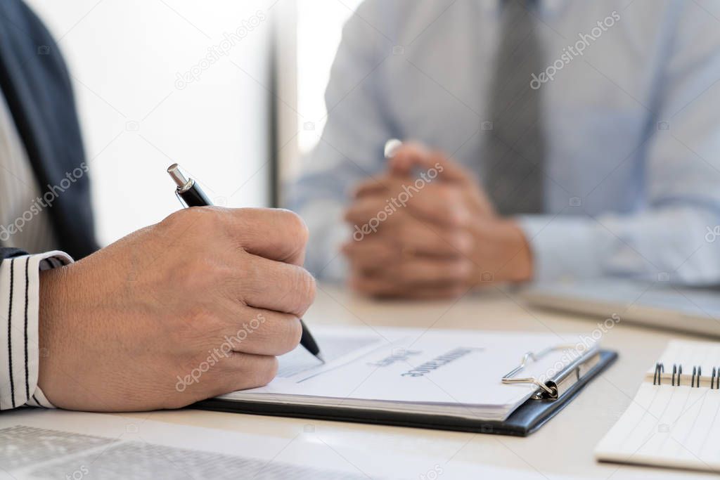 Confident insurance agent broker man holding document and presen
