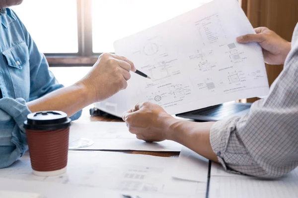 Architects engineer discussing at the table with blueprint, team — Stock Photo, Image