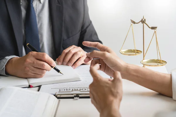 Business people and lawyers discussing contract papers sitting a — Stock Photo, Image