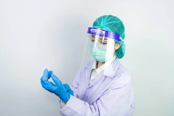 Scientist doctor wearing face mask, glasses or goggles and protective suit to fight coronavirus pandemic Covid-19, coronavirus pandemic threat quarantine, medical and healthcare concept