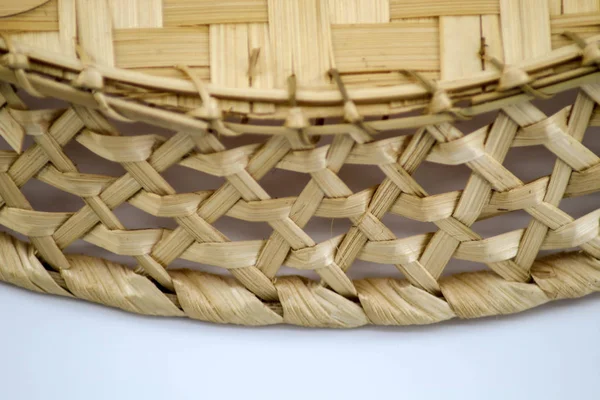 Bread box, woven from birch bark, empty lies on a white background