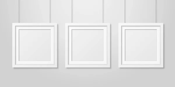 Three Vector Realistic Modern Interior White Blank Square Wooden Poster Picture Frame Set Hanging on the Ropes on White Wall Mock-up. Empty Poster Frames Design Template for Mockup, Presentation — Stock Vector