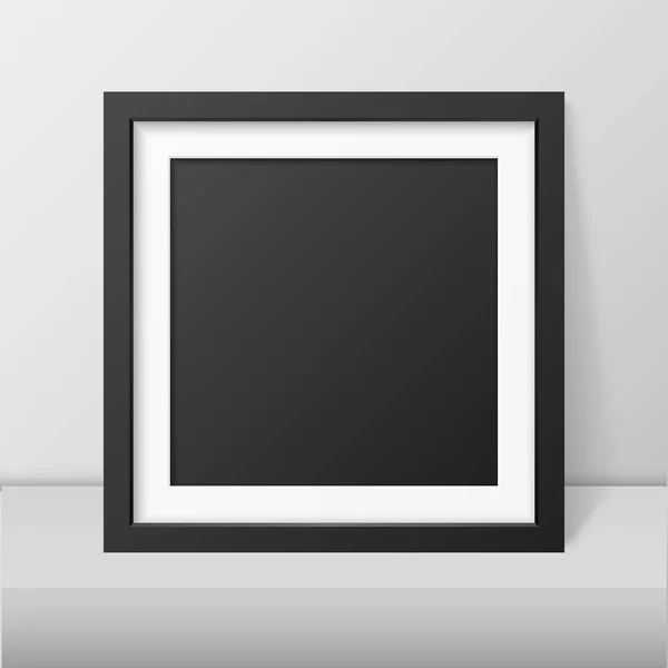 Vector 3d realista interior moderno negro en blanco vertical cuadrado madera cartel marco de la foto en la mesa, estante primer plano en la pared blanca, Mock-up. Plantilla vacía de diseño de marco de póster para mofa, presentación — Vector de stock