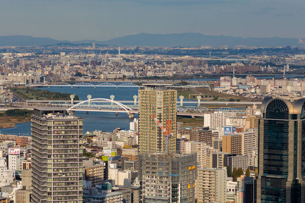 Osaka / Japan - November 25, 2017: Cityscape view of Osaka downtown from Floating Garden Observatory of Umeda Sky Building (Kuchu Teien Observatory)