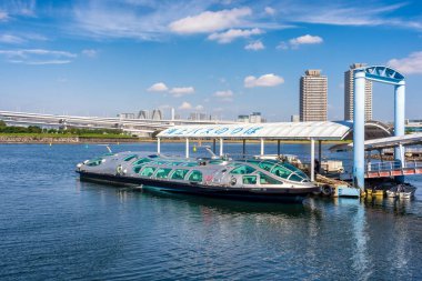 Tokyo / Japan - October 18, 2017: Himiko futuristic Tokyo tourist cruise ship, with design inspired by a spaceship, in Odaiba seaside park in Tokyo, Japan clipart