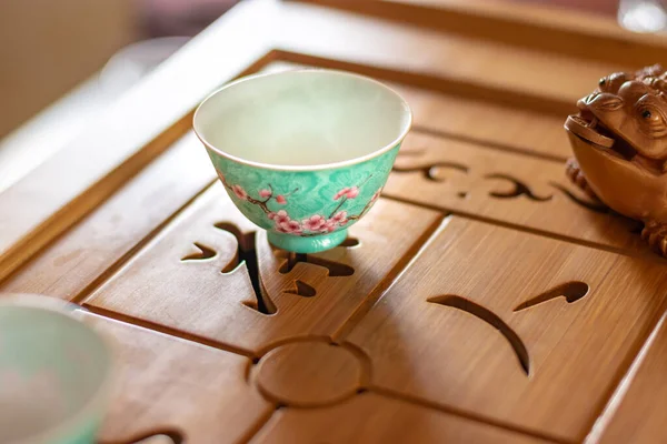 Chinese porcelain tea cup on the table, Chinese tea set image stock