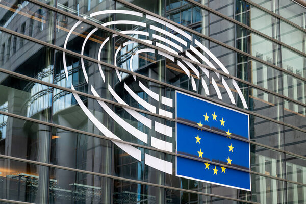 Glass facade of European Parliament building in the European Quarter of Brussels, Belgium on 16 July 2025
