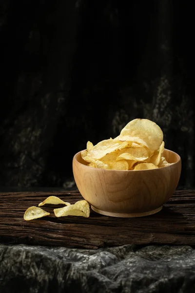 potato chip crispy in wood bowl on wood background  unhealthy cause of fat but delicious  snack