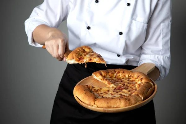 pizza pan in chef hand with cheese  stretch