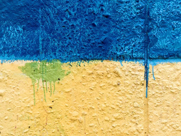 Abstract, damage to walls with many colors. Style of landscape. Rough concrete surface with cracks, scratches and paint stains. Great background or texture.