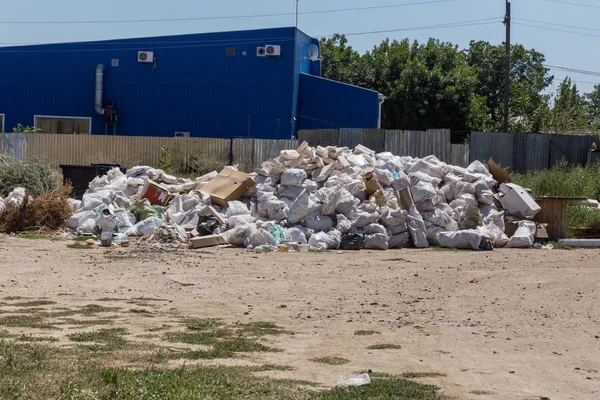 Abandoned solid household garbage on the road. Environmental pollution. Ecological problem. Abandoned garbage on the road. The problem of waste management in a big city. Illegal landfill