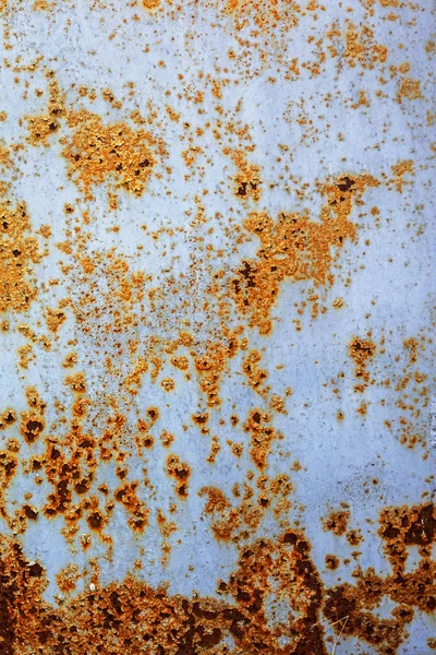 Corroded white metal background. Rusted white painted metal wall. Rusty metal background with streaks of rust. Rust stains. The metal surface rusted spots. Rysty corrosion.