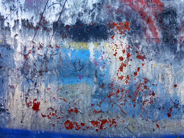 Abstract, damage to walls with many colors. Style of landscape. Rough concrete surface with cracks, scratches and paint stains. Great background or texture.