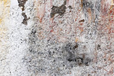 Arka plan beton duvar, yıpranma izleri yıpranmış duvar hasarlı eski boya. Boyalı beton yüzeyde eski boya kalıntıları var. Pis beton yüzey.