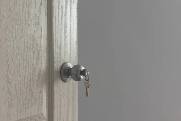 opened bedroom door with the key