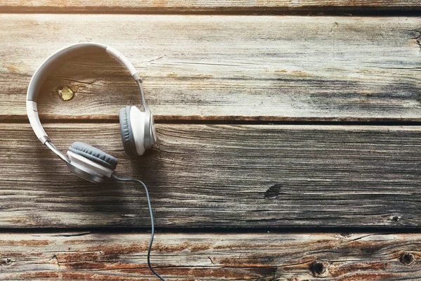 top view of Headphones on wood background