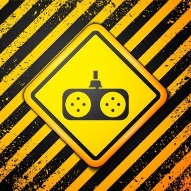Sarı arkaplanda siyah oyun alanı simgesi izole edildi. Oyun kontrolörü. Uyarı işareti. Vektör İllüstrasyonu.