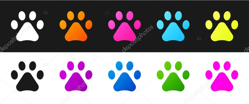 Set Paw print icon isolated on black and white background. Dog or cat paw print. Animal track. Vector