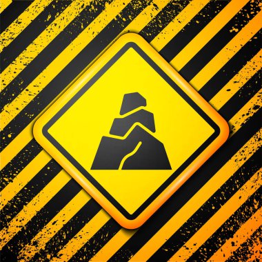 Sarı arkaplanda izole edilmiş Kara Kaya taşları simgesi. Uyarı işareti. Vektör.