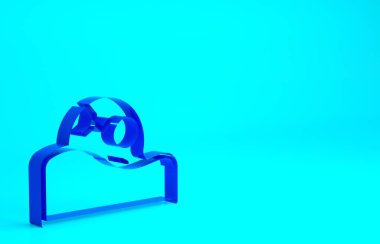 Yerdeki mavi insan kafatası mavi arka planda izole edilmiş. Minimalizm kavramı. 3d illüstrasyon 3B canlandırma.