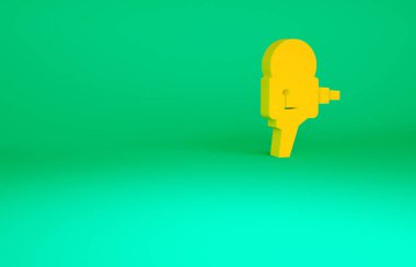 Turuncu Retro sinema kamera ikonu yeşil arkaplanda izole edildi. Video kamera. Film tabelası. Film projektörü. Minimalizm kavramı. 3d illüstrasyon 3B canlandırma.