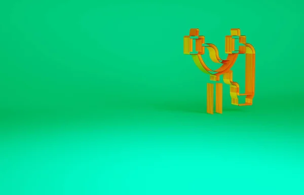 Pomarańczowa ikona procy izolowana na zielonym tle. Koncepcja minimalizmu. Ilustracja 3D 3D renderowania — Zdjęcie stockowe