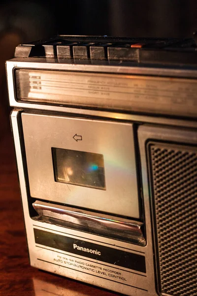 Retro outdated portable stereo boombox radio receiver with cassette recorder from circa late 70s. Vintage old style filtered photo