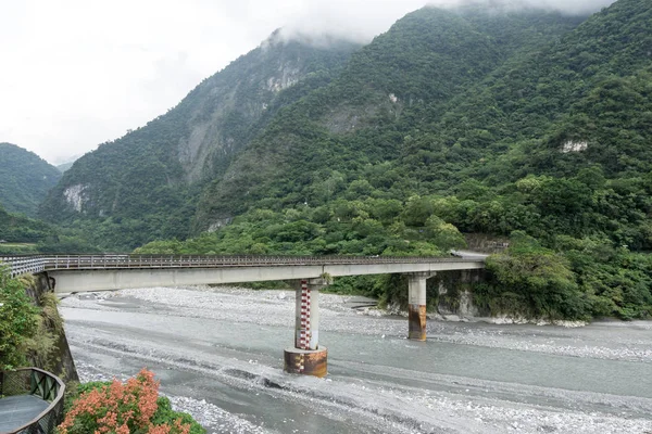 a small bridge with the view of taroko national park taken near the entrance gate