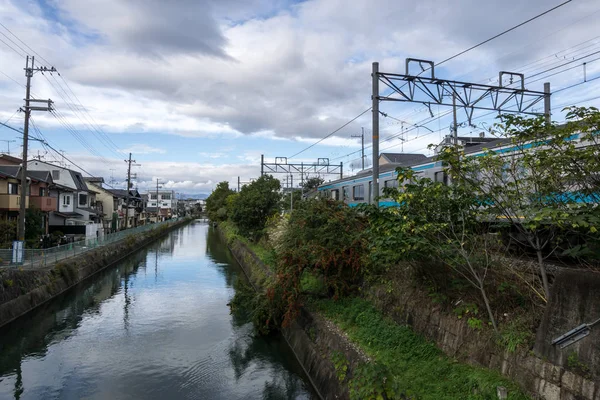 Train Passing Railroad Canal Nice Reflections Clouds Taken Kyoto Japan — Stock Photo, Image