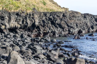 Geommeolle plaj sahne Udo ada. Geommeolle Beach ünlü siyah kum plajıdır. Jeju Adası, Güney Kore